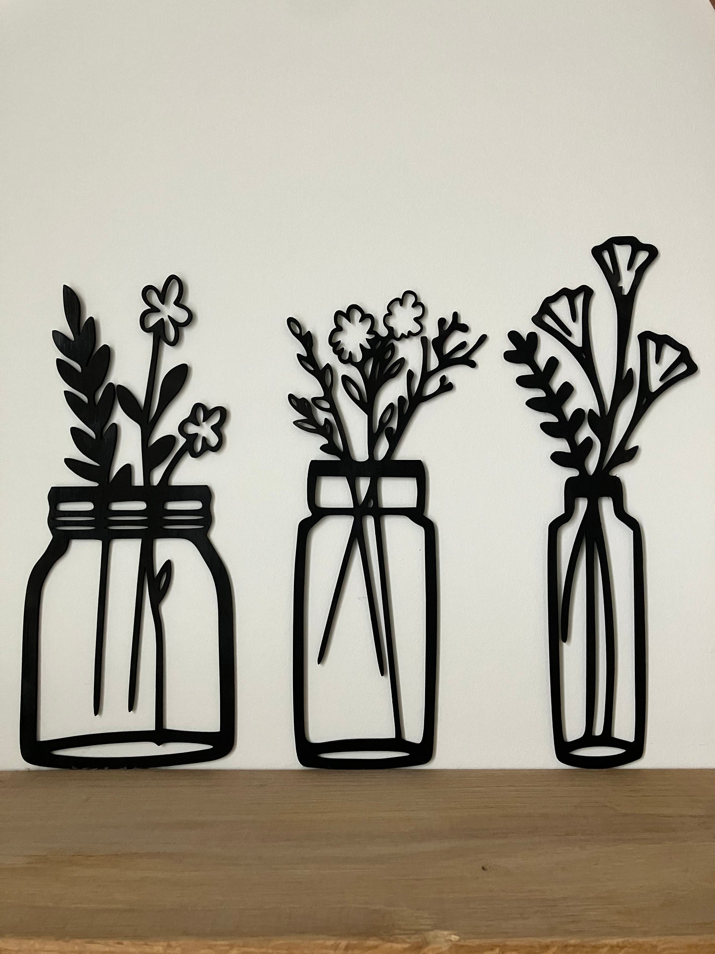 Bloemen in vaasjes
