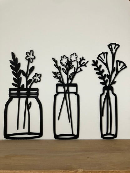 Bloemen in vaasjes