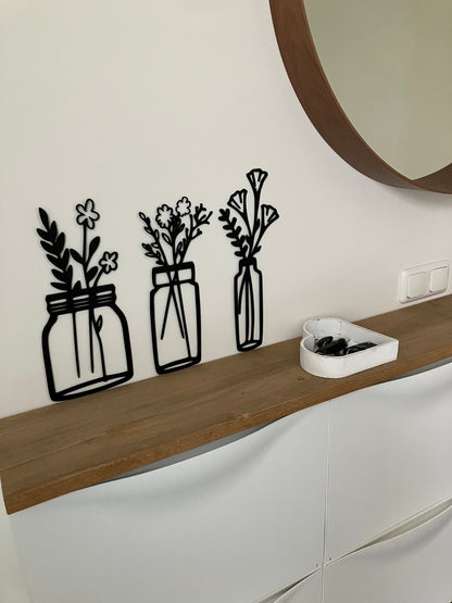 Bloemen in vaasjes